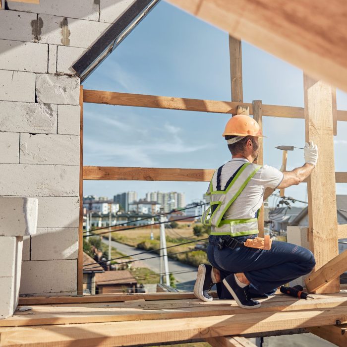 Profile photo of serious builder that being on the top floor of large construction